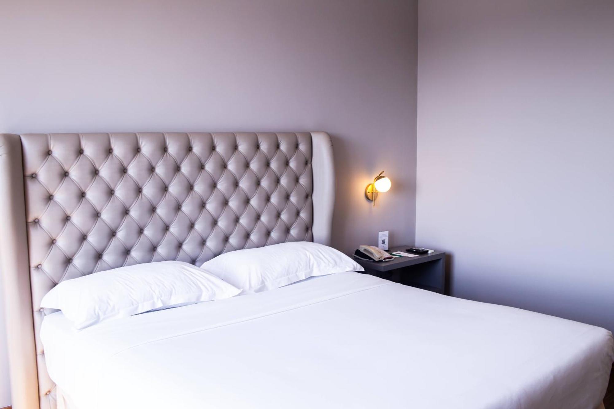 Ouro Minas Hotel Belo Horizonte, Dolce By Wyndham Buitenkant foto A bedroom at the hotel