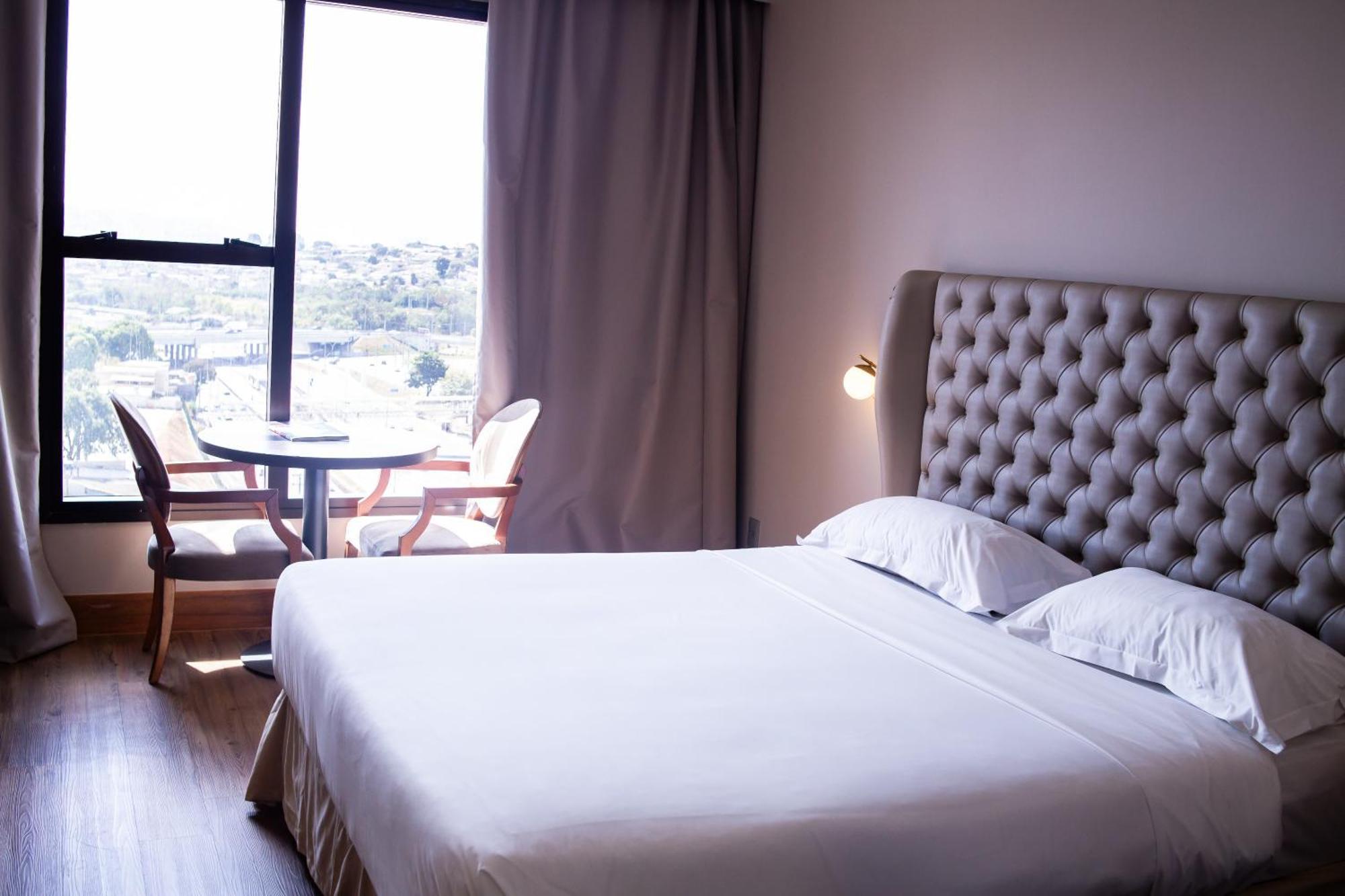 Ouro Minas Hotel Belo Horizonte, Dolce By Wyndham Buitenkant foto A bedroom at the hotel